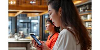 Popular Singapore food influencer creating content at local restaurant